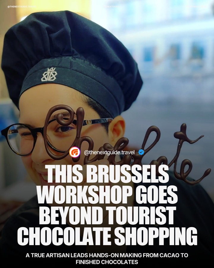 Cover of the real collaboration post: a chocolatier winking behind chocolate script spelling Chocolate — THIS BRUSSELS WORKSHOP GOES BEYOND TOURIST CHOCOLATE SHOPPING